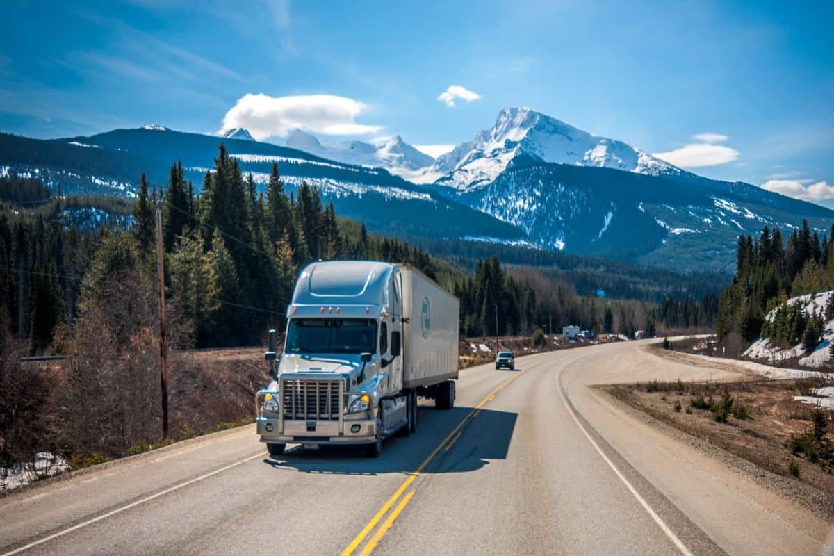 semi-truck with mountain behind